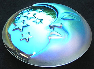 Crystal AB Moon and Stars Paperweight Glowing Lightly Pink with the Setting Sun