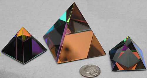 Sparkly and Colorful Crystal Pyramids to Sit on a Shelf and Entertain You As You Pass! From Left to Right Sizes are 40mm, 60mm, and 40mm, all with Peacock Color Coating. Pyramid at Right has an Carved Frosted Additional Pyramid Inside.