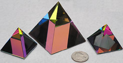 Crystal Pyramid with Peacock Color Makes Fascinating Color Patterns. This is a wonderful Desk or Shelf Decoration. Shown are Pyramid 40mm Peacock, Left, Pyramid 60mm Peacock in Middle, and Pyramid Double Bonus 40mm Peacock on Right. All shown with US Quarter for Size Comparison.