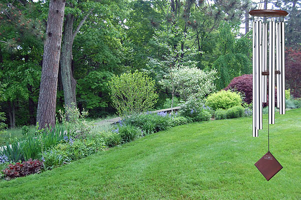 Silver 37 Inch Chimes of Earth Windchime Decorates a Beautiful Landscape.