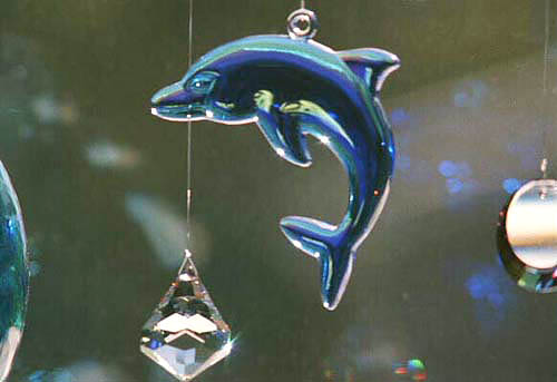 Beautiful Crystal Blue Dolphin with AB (SORRY, DISCONTINUED) With Sparkling Crystals in a Sunny Window. Crystal BELL shnes at bottom edge.