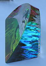 Crystal Figurine with Carved Frosted Double Dolphins in a Colorful Luminescent Sea. Enlarged to show detail. Actual size is 2.5 Inches Wide, 2.25 Inches Tall.