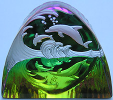 Crystal Figurine with Carved Frosted Double Dolphins in a Colorful Luminescent Sea. Enlarged to show detail. Actual size is 2.5 Inches Wide, 2.25 Inches Tall. Colors keep changing!