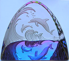 Crystal Figurine with Carved Frosted Double Dolphins in a Colorful Luminescent Sea. Enlarged to show detail. Actual size is 2.5 Inches Wide, 2.25 Inches Tall. Colors keep changing!