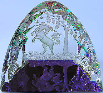 Crystal Figurine with Carved Frosted Unicorn in a Colorful Luminescent Crystal Forest. Enlarged to show detail. Actual size is 2.5 Inches Wide, 2.25 Inches Tall.