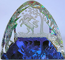Crystal Figurine with Carved Frosted Unicorn in a Colorful Luminescent Crystal Forest. Enlarged to show detail. Actual size is 2.5 Inches Wide, 2.25 Inches Tall.