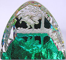 Crystal Figurine with Carved Frosted Unicorn in a Colorful Luminescent Crystal Forest. Enlarged to show detail. Actual size is 2.5 Inches Wide, 2.25 Inches Tall.