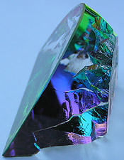 Crystal Figurine with Carved Frosted Unicorn in a Colorful Luminescent Crystal Forest. Enlarged to show detail. Actual size is 2.5 Inches Wide, 2.25 Inches Tall.