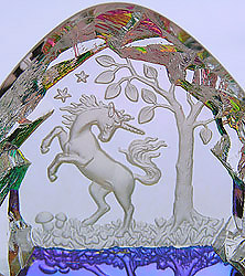 Crystal Figurine with Carved Frosted Unicorn in a Colorful Luminescent Crystal Forest. Enlarged to show detail. Actual size is 2.5 Inches Wide, 2.25 Inches Tall.