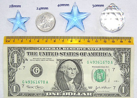Dollar Bill, Two Rulers, US Quarater, and Three Crystals. Crystals are Star 28mm Blue, Star 40mm Blue, and Ball 30mm.