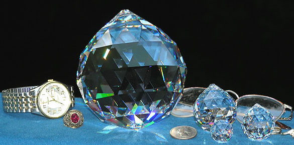Amazing Ball 100mm (4 Inches)! Shown with Ball 40mm, Ball 20mm, and Ball 30mm, US Quarter, Eyeglasses and a Man's Watch for Size Comparison. Truly a Wonderful Crystal Ball!!