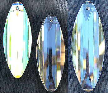 Swarovski Surfboard Crystal. At left is AB crystal, at right is Clear Crystal shown twice. All Crystals are Same Size, with different photo magnification. Crystal is 50mm size.